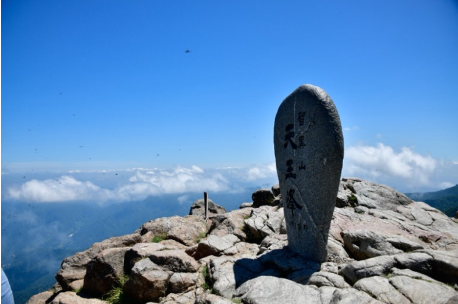 Cheonwangbong Summit Stone at 1,915m in Jirisan National Park with scenic ridge view